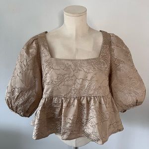 En Saison Cropped Peplum Puff Sleeve Jacquard Blouse in a bronze/tan color